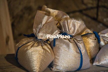 Shiny Gold Fabric Gift Bags with Blue Ties